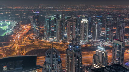 JLT and Dubai marina skyscrapers near Sheikh Zayed Road aerial night timelapse. Residential buildings
