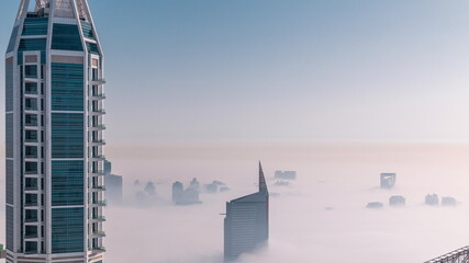 Dubai Aerial view showing fog over al barsha heights and greens district area timelapse