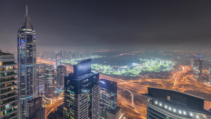 Fototapeta na wymiar Panorama of Dubai Marina with JLT skyscrapers and golf course night timelapse, Dubai, United Arab Emirates.