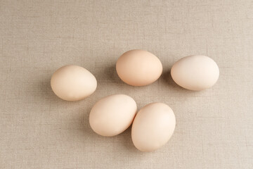 Fresh chicken eggs ( Telur Ayam Kampung ). White eggs with copy space. Selective focus image.
