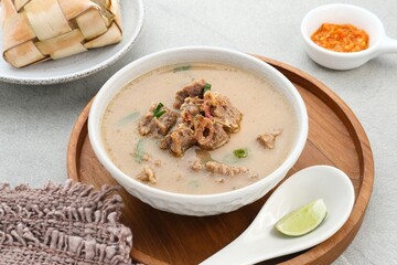 Coto Makassar, traditional food from Makassar, South Sulawesi. made from beef offal mixed with beef, seasoned with specially formulated spices. Usually served with Burasa or Ketupat ( rice cake ).
