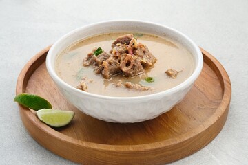 Coto Makassar, traditional food from Makassar, South Sulawesi. made from beef offal mixed with beef, seasoned with specially formulated spices. Usually served with Burasa or Ketupat ( rice cake ).
