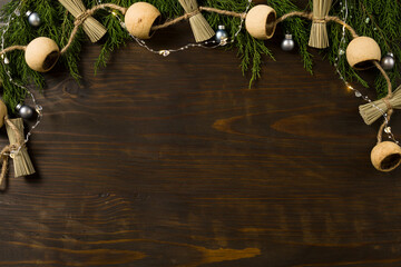 Christmas composition. Gift, fir tree branches, decorations on wooden background. Christmas, winter, new year concept. Flat lay, top view, copy space