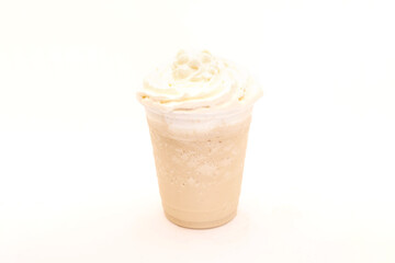 Vanilla frappe served in a to go plastic cup for take away.