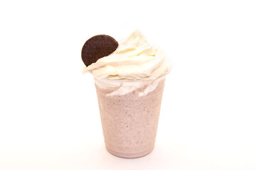 Cookies and cream milk shake with chocolate biscuit and whipped cream.