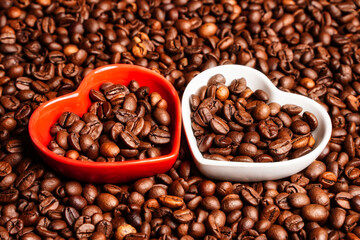 Fototapeta premium Selective focus on hearts with coffee beans. Good morning coffee lover. Close up