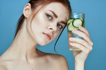 pretty woman with cucumber drink health vitamins