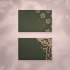 Green business card template with luxurious brown pattern for your brand.