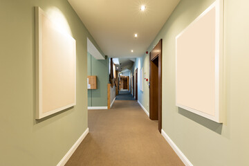 Interior of a long corridor with mock up for paintings, blank frame