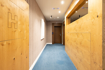 Interior of a carpeted hotel corridor doorway