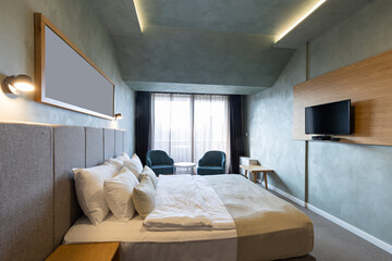 Master bed in hotel bedroom