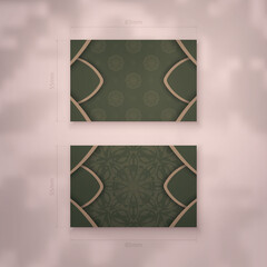 Green business card with Indian brown ornament for your personality.