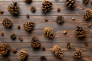 pine cones on colored table. natural holiday background with pinecones grouped together. Flat lay. Winter concept