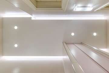 suspended ceiling with halogen spots lamps and drywall construction in empty room in apartment ,...
