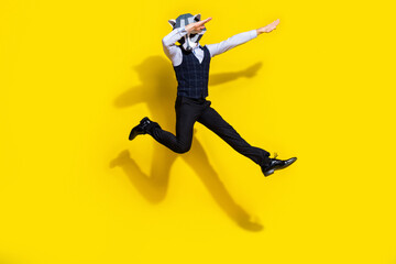 Full body photo of absurd surreal wacky guy racoon mask jump dance dabber wear trendy outfit isolated over yellow color background