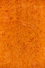 Rusty metallic background in warm tone. Industrial textured material