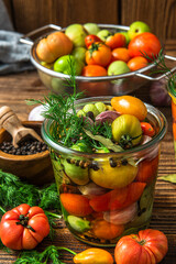 Pickled Tomatoes in Jar with Herbs and Garlic