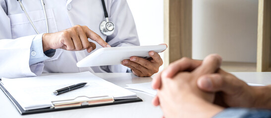 Fototapeta premium Doctor presenting report of diagnosis, symptom of disease and recommend something a method with patient treatment, after results about the problem illness of patient