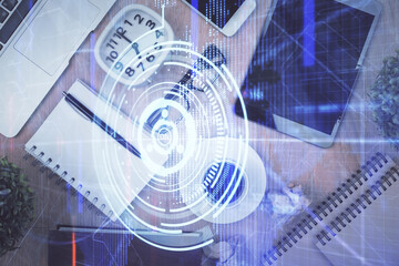 Double exposure of technology theme drawing over work table desktop. Top view. Global data analysis concept.