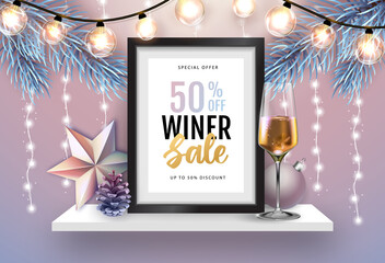 Winter sale poster with christmas holiday decorations. Chrisrmas background with string of lights. 3D interior design with black frame on white walll shelf.
