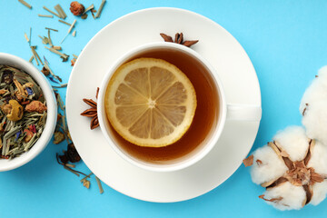 Concept of hot drink with tea on blue background