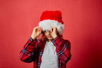 Christmas little Girl in Santa Hat is offended at someone