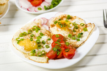 fried eggs, baguette with herb butter and coffee