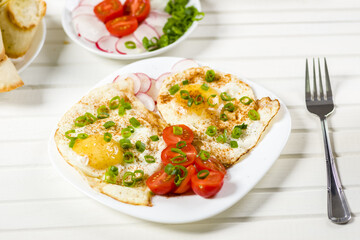 fried eggs, baguette with herb butter and coffee