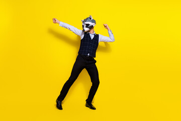 Fototapeta na wymiar Profile photo of careless funky crazy man enjoy disco wear raccoon polygonal mask vest isolated yellow color background