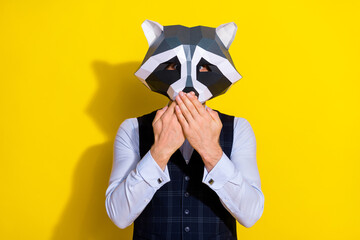 Photo of speechless crazy character palms cover mouth wear raccoon polygonal mask vest isolated...