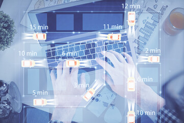 Double exposure of man's hands typing over computer keyboard and automobile theme hologram drawing....