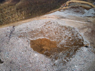 Aerial drone view of stack of different types of large mountain garbage pile