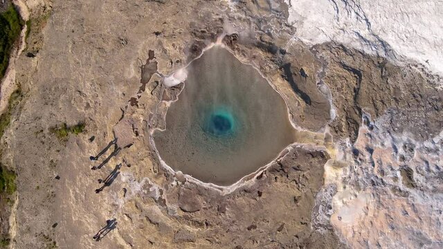Aerial Cinematic footage of the Impressive Icelands Geysir Geisir in the Golden Circule, the geothermal activity and a attraction for tourists in Iceland	