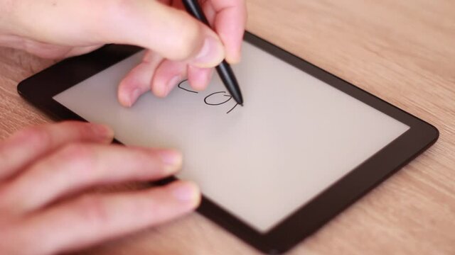 Writing COVID on Electronic tablet