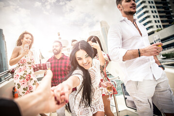 Group of friends making party on a yacht in Dubai