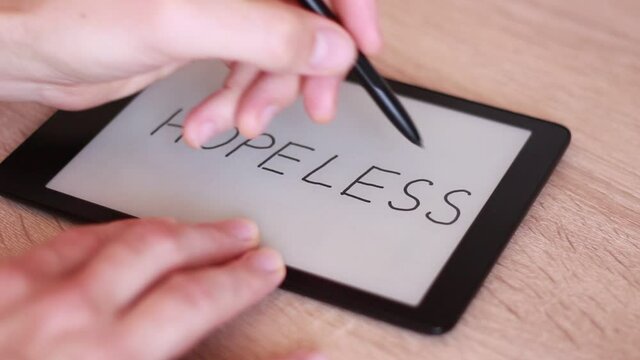 Inscription HOPELESS on Electronic tablet