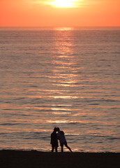 silhouette of couple at sunset