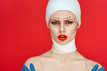 woman posing in blue gloves red lips surgery facial rejuvenation isolated background