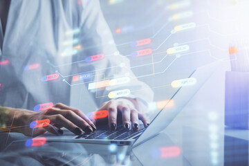 Double exposure of woman hands working on computer and data theme hologram drawing. Tech concept.