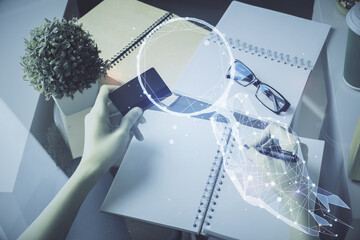 Double exposure of woman on-line shopping holding a credit card and creative drawing. e-commerce concept.