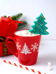Red mug with hot chocolate with marshmallows.