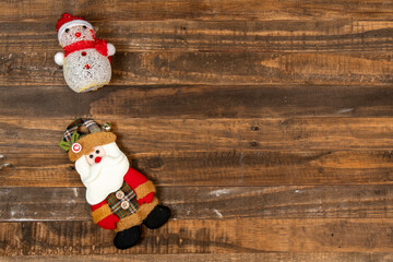 Felt Santa Claus doll, dressed in winter clothes and a snowsuit.