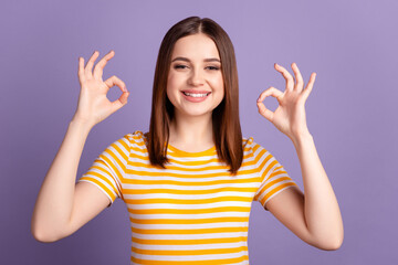 Photo of young lovely girl show fingers okey symbol great recommend advertise isolated over violet color background