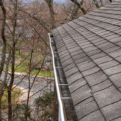 A gutter that has been cleaned to prevent water damage water in the basement and ice dams over the...