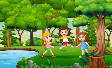 Cheerful the children playing jump rope at nature