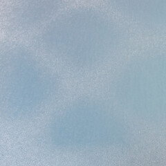 Frost on the metal surface of the car with a blue blur effect. Abstract background and texture for design.