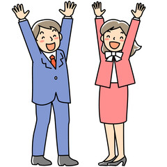 笑顔でバンザイをする若い女性と男性