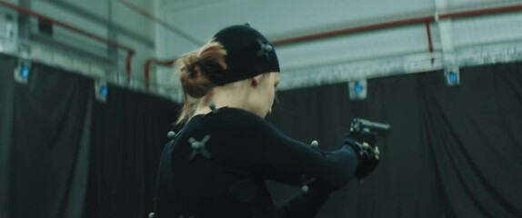 BTS Female actor wearing motion capture suit acting as a game or animation movie character. Motion capture is an unparalleled method for making animated characters move more realistically - Powered by Adobe