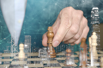 Human hand playing chess, business concept