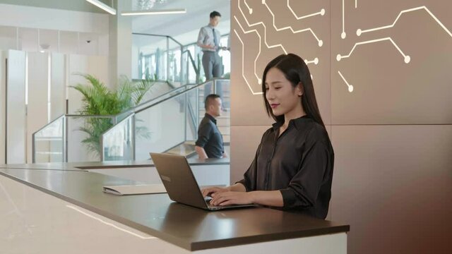 Young businesswoman standing at office reception desk,4K